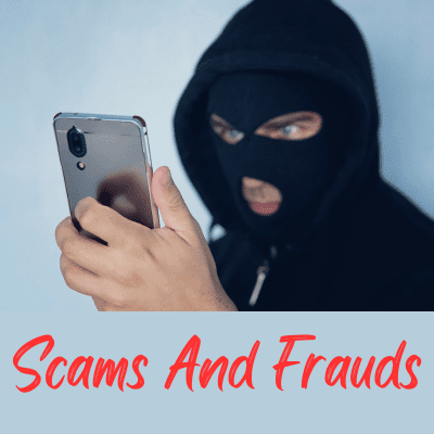 Scams And Frauds - Image of man wearing a Black hood and black ski mask looking at a phone. Image has the text Scams and Frauds in red.